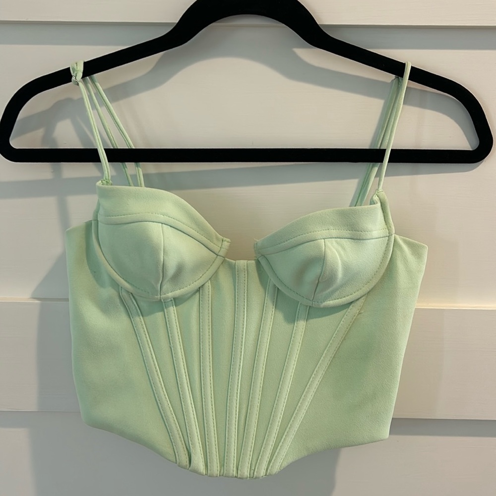 Zara small corset side zip top with adjustable straps.